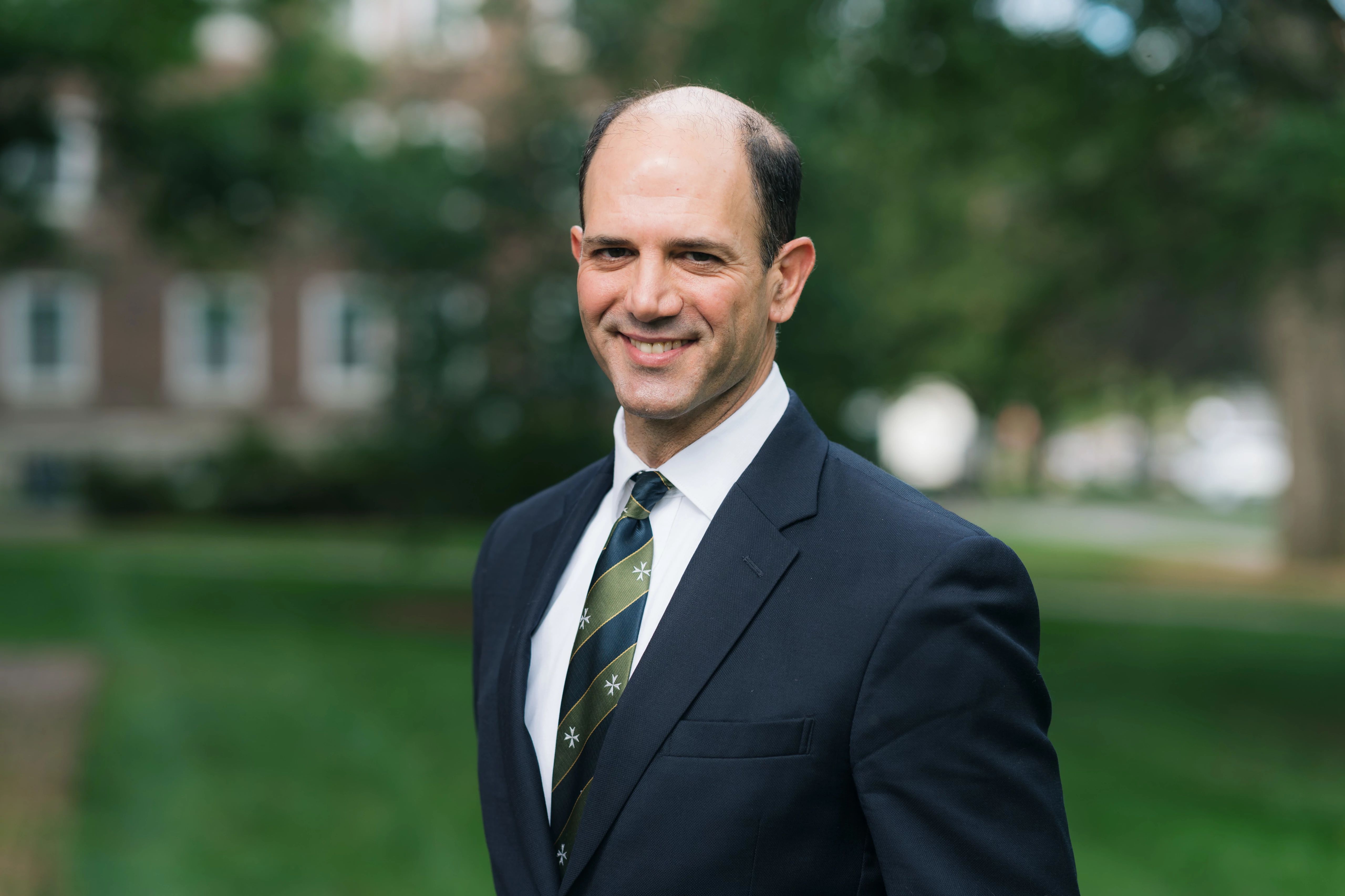 Portrait of Scott Brown, blue blazer, green/blue striped tie