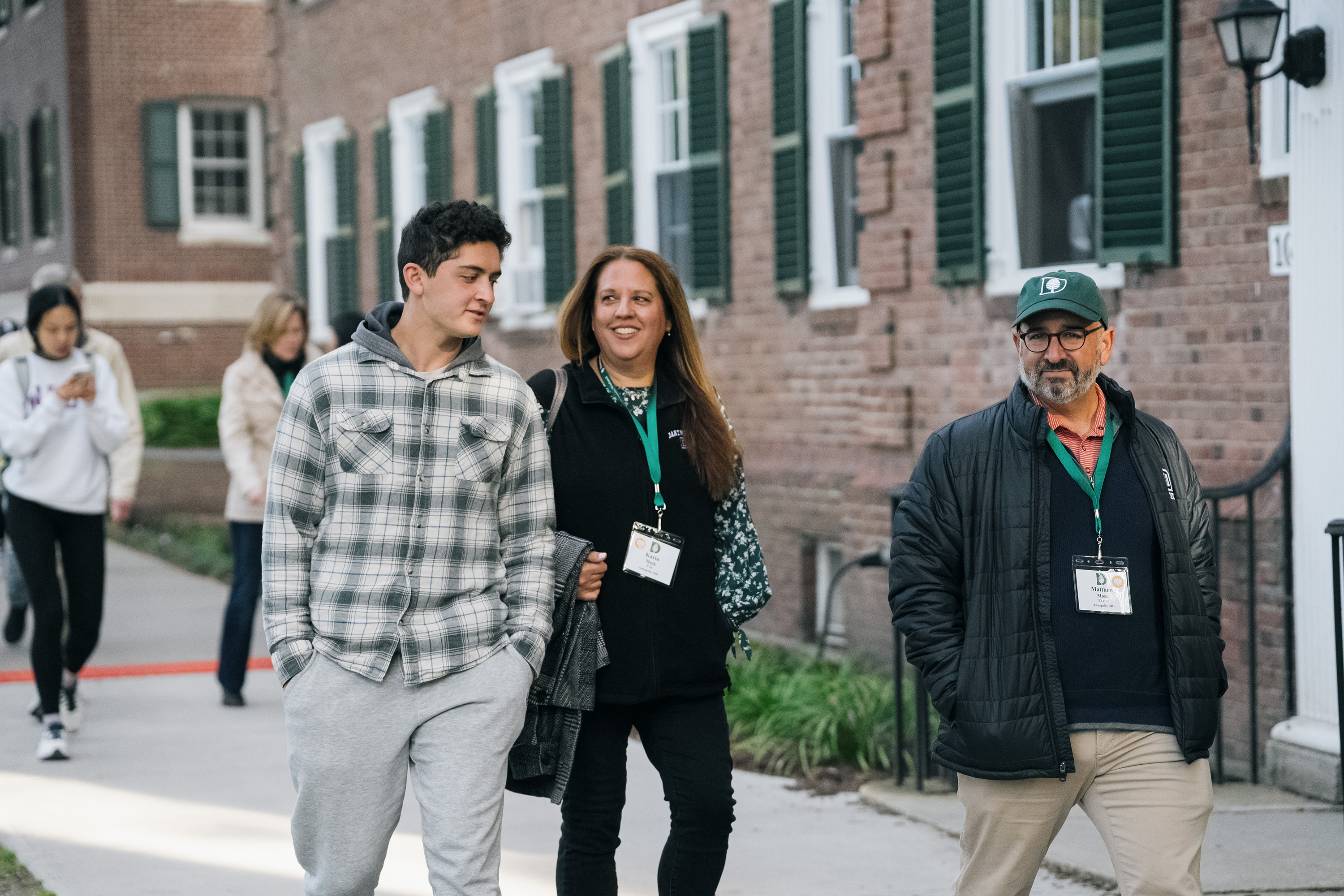 Students walking with their parents during 2023 Family Weekend.