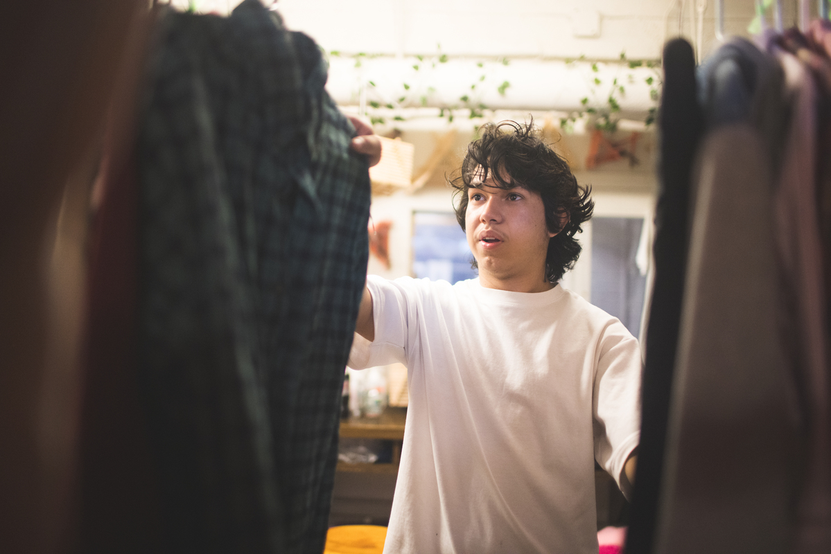 Student sorts through clothing